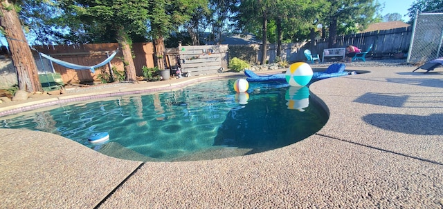 2773 Crystal Tree Dr, Redding, CA 96001 - view of swimming pool featuring a fenced backyard and a patio