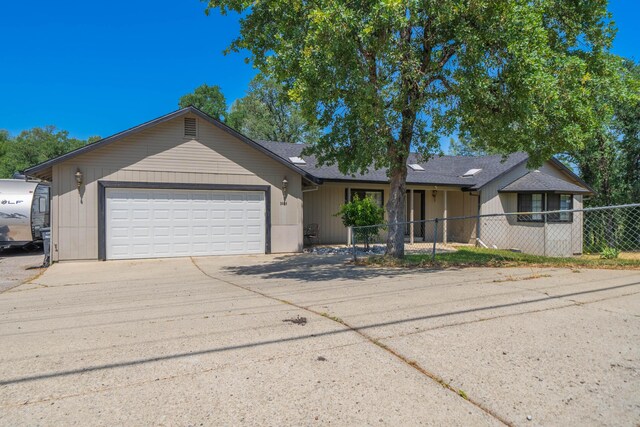 3608 Oasis Rd, Redding, CA 96003 - ranch-style home featuring fence, a garage, and driveway