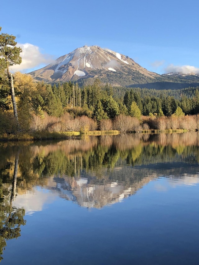35267 Nehemiah Dr, Shingletown, CA 96088 - water view featuring a mountainous background and a heavily wooded area