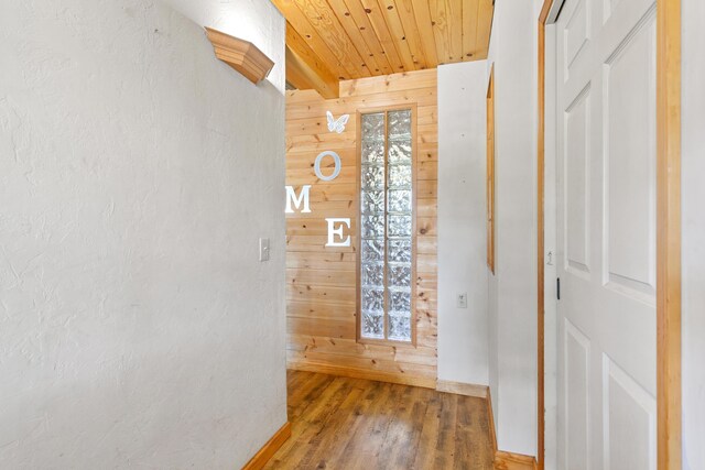 27339 Hobart Rd, Shingletown, CA 96088 - hall with wood walls, wood finished floors, and wooden ceiling