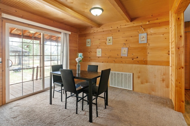27339 Hobart Rd, Shingletown, CA 96088 - dining area with beam ceiling, wood walls, carpet flooring, and wooden ceiling