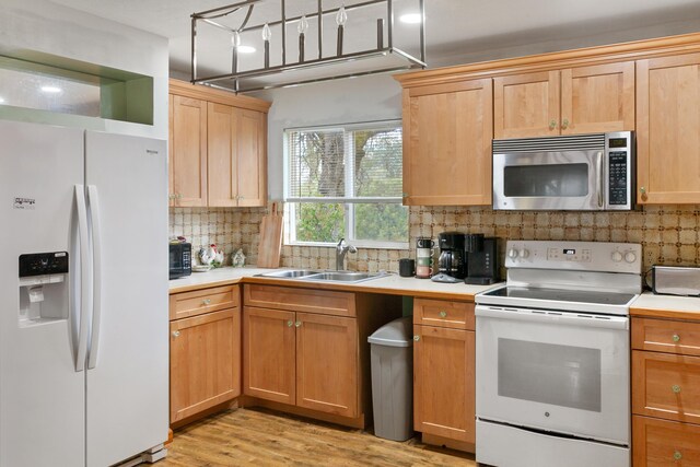 27339 Hobart Rd, Shingletown, CA 96088 - kitchen featuring white appliances, a sink, tasteful backsplash, light wood finished floors, and light countertops