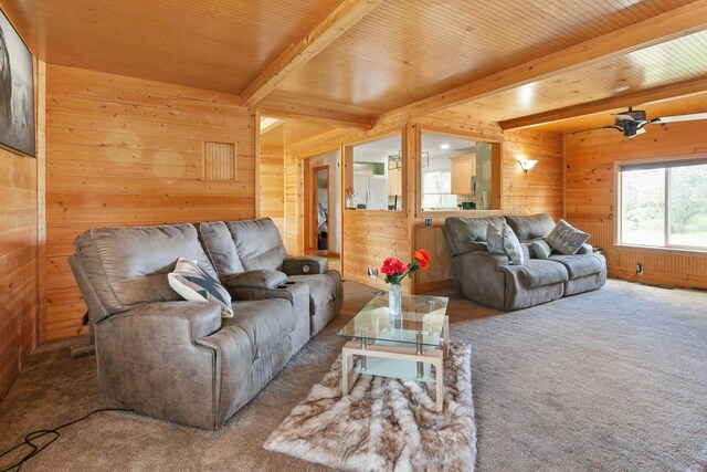 27339 Hobart Rd, Shingletown, CA 96088 - carpeted living area with wooden walls, beamed ceiling, and wood ceiling