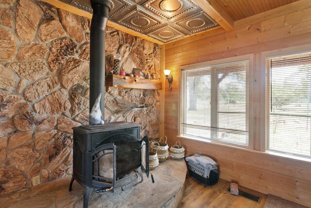 27339 Hobart Rd, Shingletown, CA 96088 - detailed view of a wood stove, wooden walls, and wood finished floors