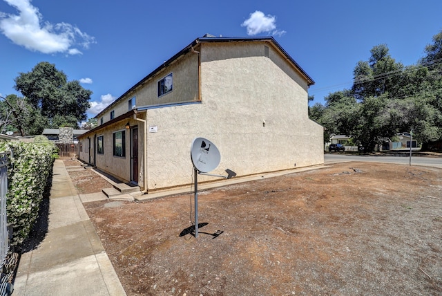 3580 Ricardo Ave, Redding, CA 96002 - view of side of property with stucco siding and fence
