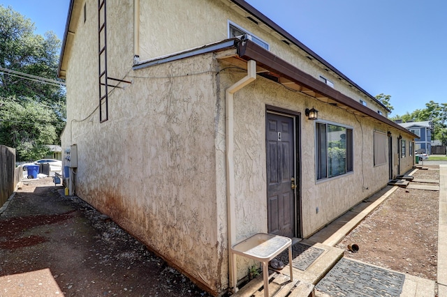 3580 Ricardo Ave, Redding, CA 96002 - view of property exterior with stucco siding and fence