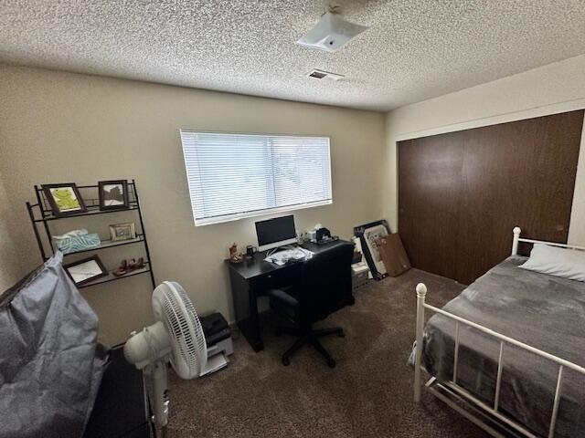 3580 Ricardo Ave, Redding, CA 96002 - carpeted office featuring a textured ceiling