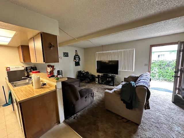 3580 Ricardo Ave, Redding, CA 96002 - living room with a textured ceiling and light tile patterned floors