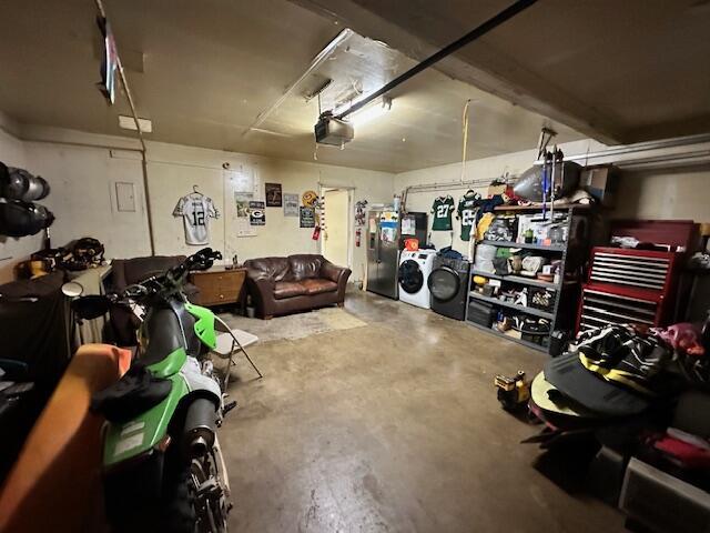 3580 Ricardo Ave, Redding, CA 96002 - garage with separate washer and dryer, stainless steel fridge, and a garage door opener