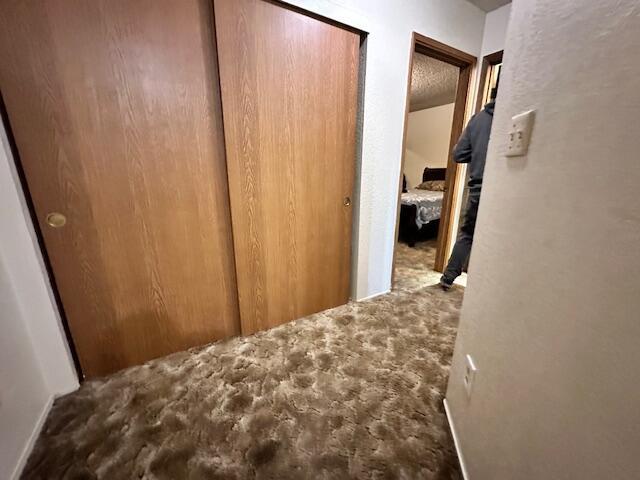 3580 Ricardo Ave, Redding, CA 96002 - hallway with carpet flooring