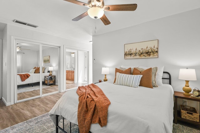 19186 Knighton Rd, Redding, CA 96001 - bedroom with wood finished floors, connected bathroom, ceiling fan, and baseboards