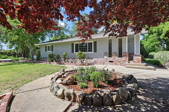 19186 Knighton Rd, Redding, CA 96001 - single story home featuring covered porch and a front lawn