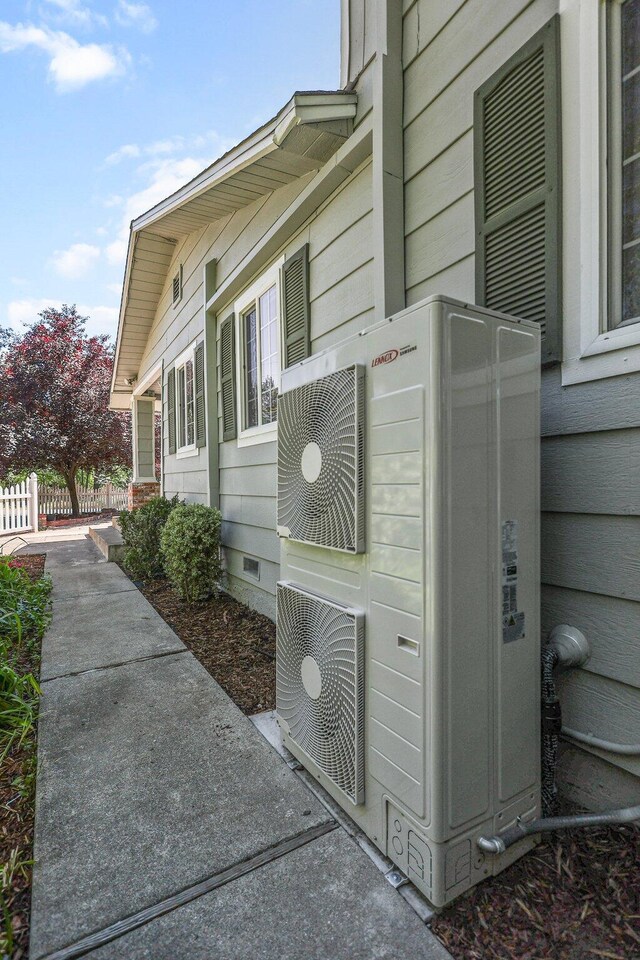 19186 Knighton Rd, Redding, CA 96001 - view of side of property featuring crawl space, fence, and a cooling unit