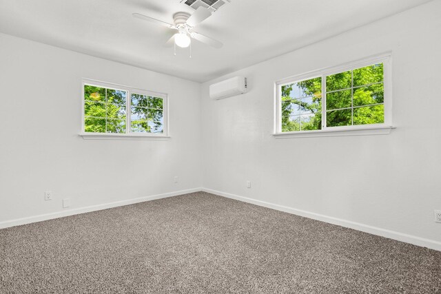 19186 Knighton Rd, Redding, CA 96001 - unfurnished room featuring a wall mounted air conditioner, baseboards, carpet floors, and ceiling fan