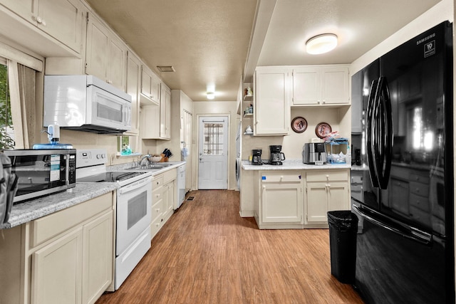 1704 Ashby Rd, Shasta Lake, CA 96019 - kitchen with white appliances, light wood-style floors, a sink, white cabinetry, and open shelves