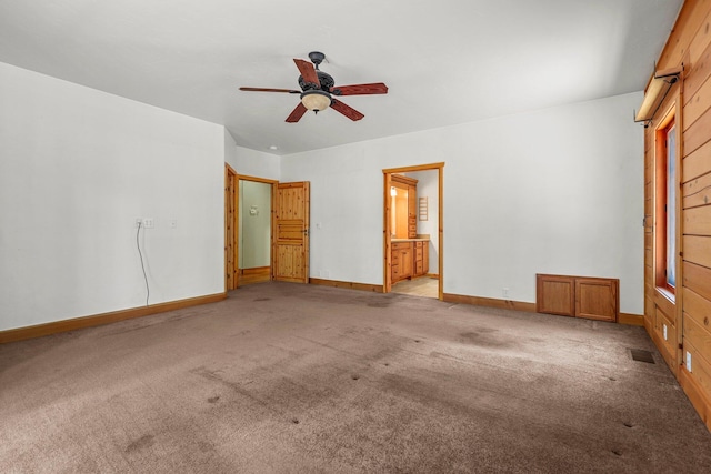 7185 Whispering Winds Ct, Shingletown, CA 96088 - unfurnished bedroom with light carpet, baseboards, ensuite bath, and a ceiling fan