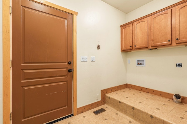 7185 Whispering Winds Ct, Shingletown, CA 96088 - washroom featuring baseboards, washer hookup, cabinet space, and electric dryer hookup