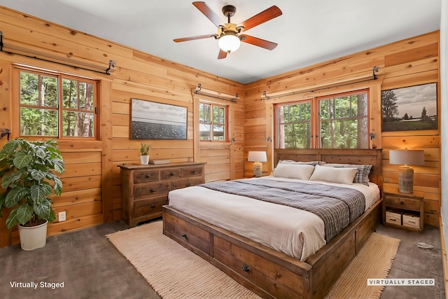 7185 Whispering Winds Ct, Shingletown, CA 96088 - carpeted bedroom with wood walls and a ceiling fan