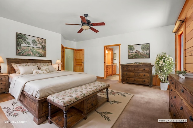 7185 Whispering Winds Ct, Shingletown, CA 96088 - bedroom featuring connected bathroom, a ceiling fan, and light colored carpet