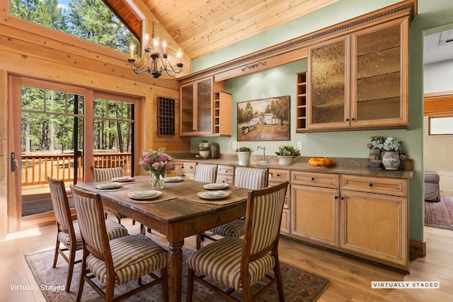 7185 Whispering Winds Ct, Shingletown, CA 96088 - dining space featuring vaulted ceiling, wooden ceiling, a chandelier, and light wood-style flooring