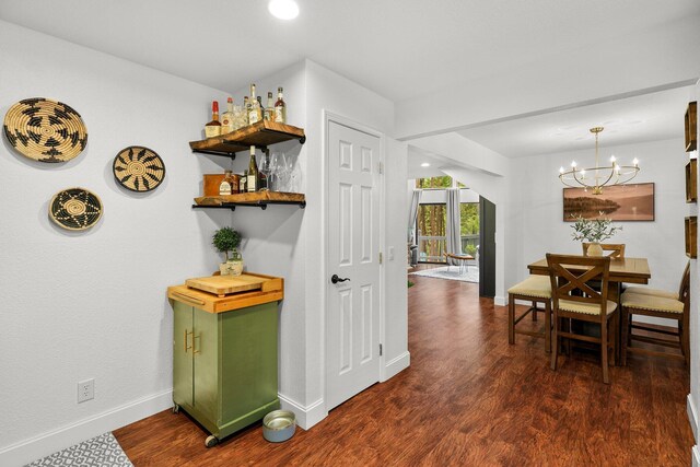 30681 Sleepy Hollow Dr, Shingletown, CA 96088 - hallway featuring dark wood-style floors and a chandelier