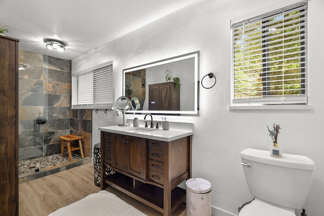 30681 Sleepy Hollow Dr, Shingletown, CA 96088 - full bathroom featuring vanity, a walk in shower, and wood finished floors