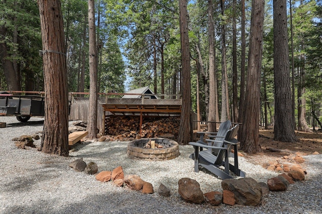 30681 Sleepy Hollow Dr, Shingletown, CA 96088 - view of yard with a fire pit and a wooden deck