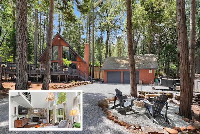 30681 Sleepy Hollow Dr, Shingletown, CA 96088 - view of yard featuring a fire pit, an outdoor structure, a deck, and a detached garage
