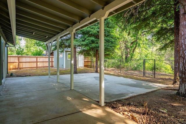 507 Olympic St, Redding, CA 96003 - view of patio featuring a fenced backyard, an outdoor structure, and a shed