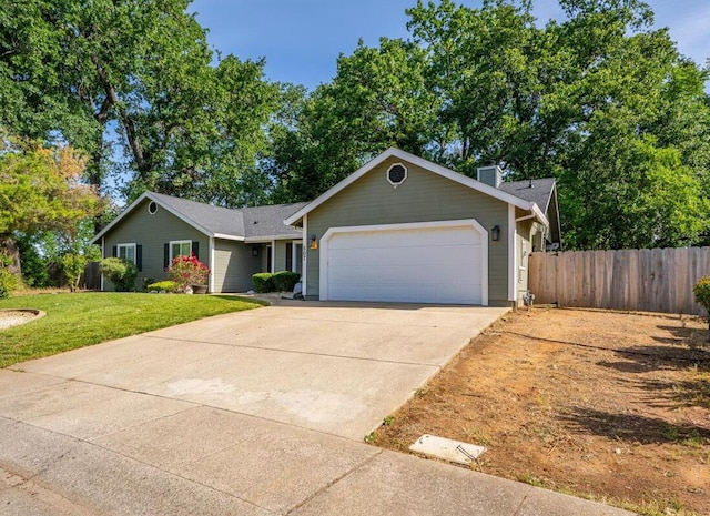 507 Olympic St, Redding, CA 96003 - ranch-style home featuring an attached garage, driveway, and a chimney