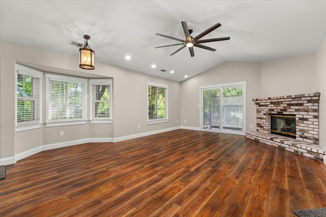 507 Olympic St, Redding, CA 96003 - unfurnished living room featuring a ceiling fan, wood finished floors, a fireplace, vaulted ceiling, and baseboards