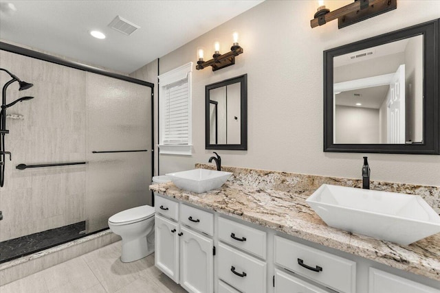 507 Olympic St, Redding, CA 96003 - bathroom with a stall shower, toilet, and double vanity