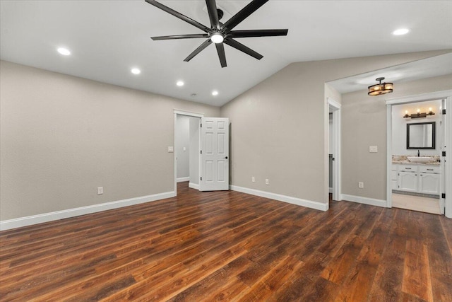 507 Olympic St, Redding, CA 96003 - unfurnished living room featuring dark wood finished floors, a sink, baseboards, vaulted ceiling, and ceiling fan