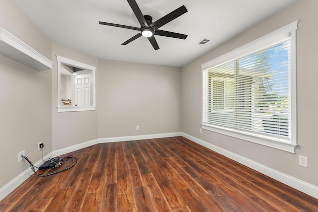 507 Olympic St, Redding, CA 96003 - empty room with dark wood finished floors, a ceiling fan, and baseboards