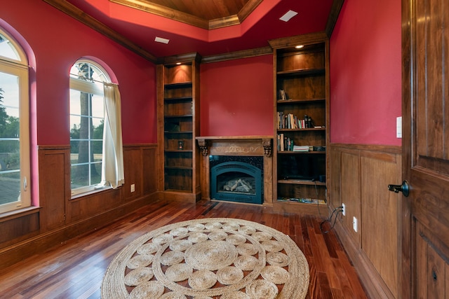 4684 Oak Glen Dr, Redding, CA 96001 - living area with crown molding, dark wood-type flooring, wainscoting, a high end fireplace, and a raised ceiling