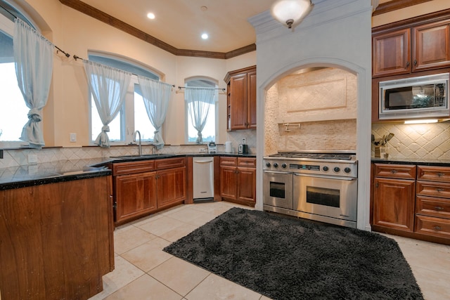 4684 Oak Glen Dr, Redding, CA 96001 - kitchen with appliances with stainless steel finishes, backsplash, a sink, crown molding, and light tile patterned floors