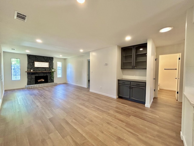 1808 Del Mar Ave, Redding, CA 96003 - unfurnished living room with light wood-style floors, healthy amount of natural light, baseboards, and recessed lighting