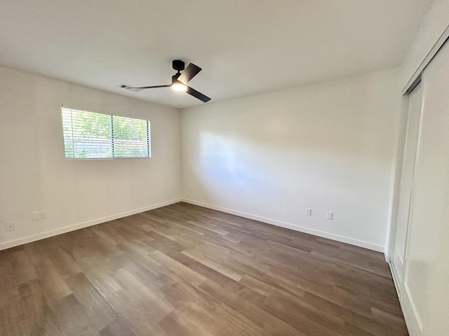 1808 Del Mar Ave, Redding, CA 96003 - unfurnished bedroom featuring dark wood finished floors, baseboards, and a closet