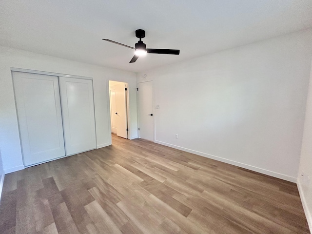 1808 Del Mar Ave, Redding, CA 96003 - unfurnished bedroom featuring light wood-style floors, baseboards, a closet, and a ceiling fan