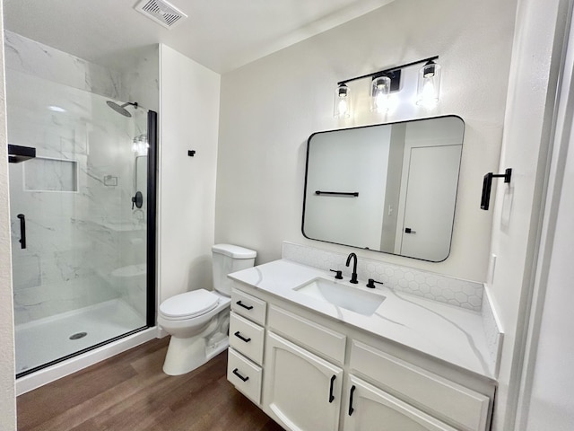 1808 Del Mar Ave, Redding, CA 96003 - full bathroom with wood finished floors, a marble finish shower, toilet, and vanity