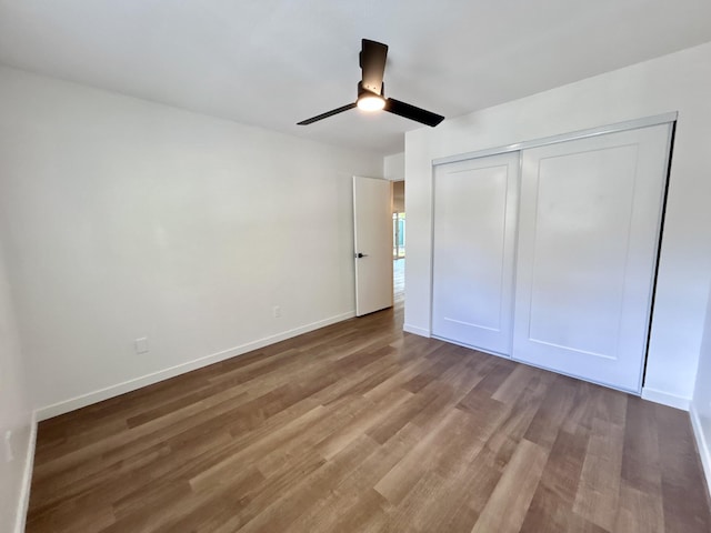 1808 Del Mar Ave, Redding, CA 96003 - unfurnished bedroom with wood finished floors, a closet, baseboards, and ceiling fan