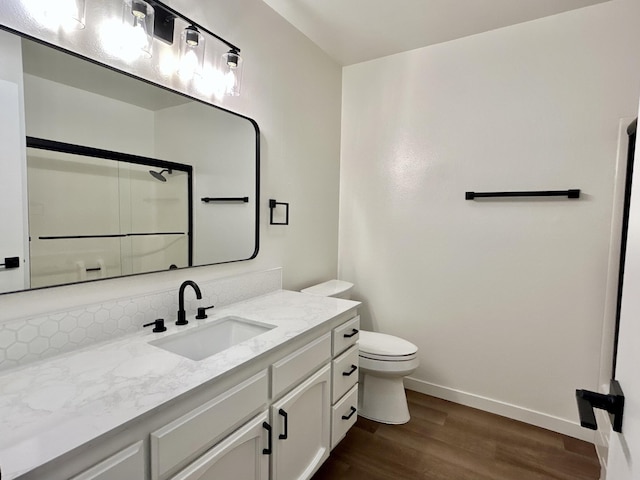 1808 Del Mar Ave, Redding, CA 96003 - full bathroom with wood finished floors, toilet, baseboards, a shower with door, and vanity