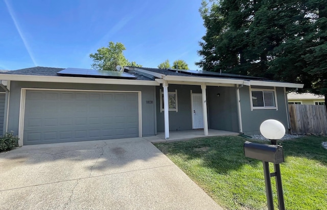 1808 Del Mar Ave, Redding, CA 96003 - single story home with a garage, driveway, roof mounted solar panels, and covered porch