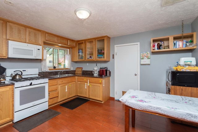 1384 Diamond St, Anderson, CA 96007 - kitchen with white appliances, a sink, a textured ceiling, glass insert cabinets, and wood finished floors