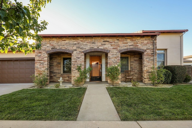 20284 Domaine Pl, Anderson, CA 96007 - view of front of property with stone siding, a front yard, stucco siding, and an attached garage