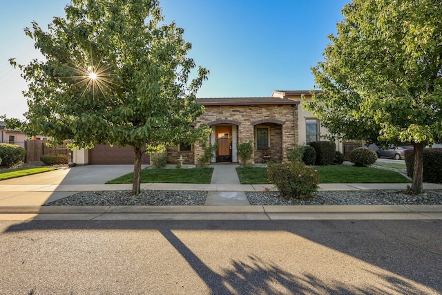 20284 Domaine Pl, Anderson, CA 96007 - view of front facade featuring driveway, a garage, and stone siding