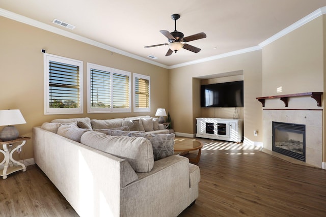20284 Domaine Pl, Anderson, CA 96007 - living area featuring wood finished floors, a tile fireplace, ornamental molding, a ceiling fan, and baseboards
