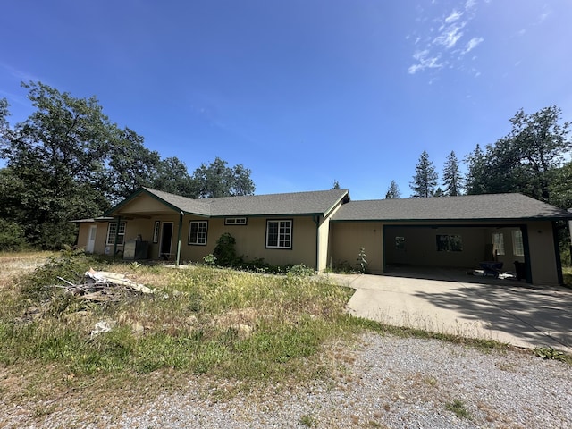 17171 Flanagan Rd, Redding, CA 96003 - ranch-style house with concrete driveway and a garage