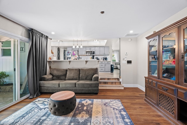 3689 Suzanne Way, Redding, CA 96002 - living room featuring dark wood-style floors, baseboards, and recessed lighting