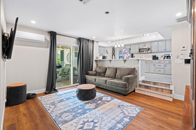 3689 Suzanne Way, Redding, CA 96002 - living room featuring light wood finished floors, baseboards, a wall mounted air conditioner, and recessed lighting